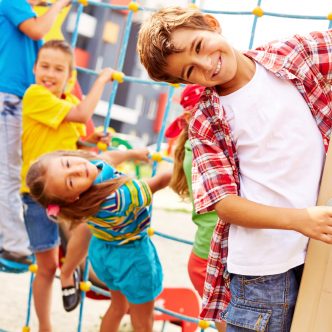 Image of joyful friends having fun on playground outdoors
